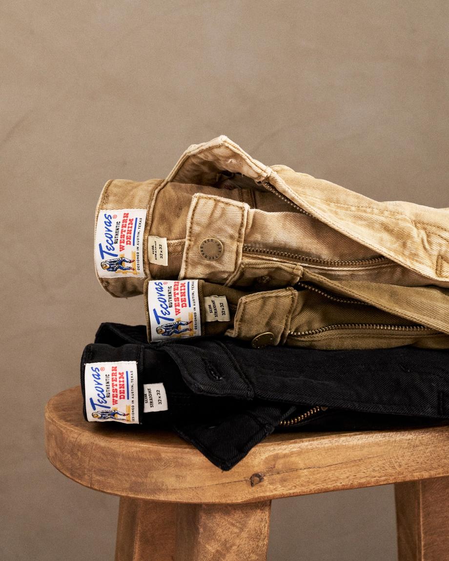 A stack of pants on a stool.