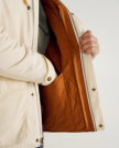 Closeup view of Men's Ranch Coat - Ivory / Saddle