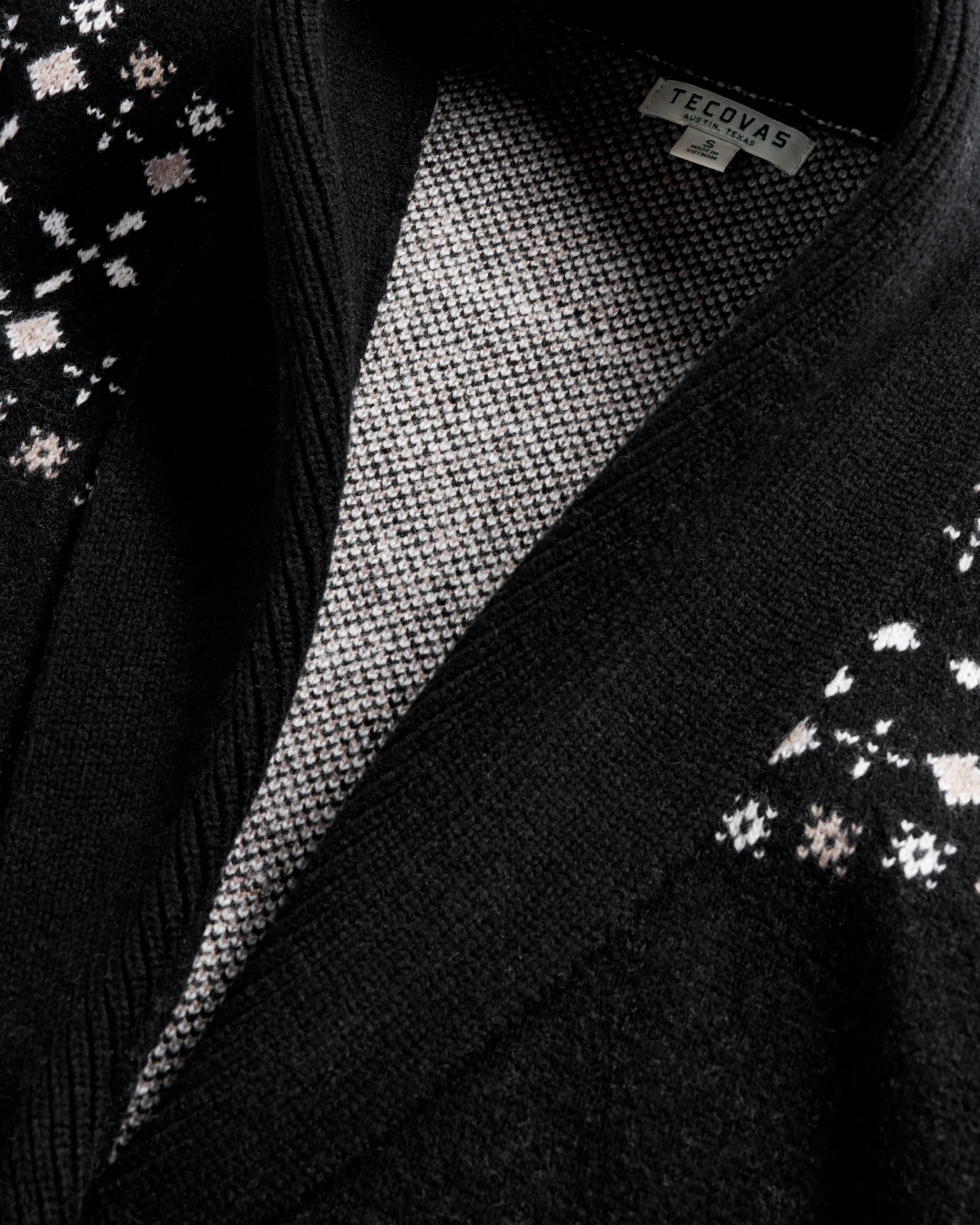 Closeup detail view of Women's Shawl Collar Wrap Sweater - Black / White