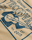 Closeup view of Men's Guitar Fine Goods Tee - Khaki / Blue