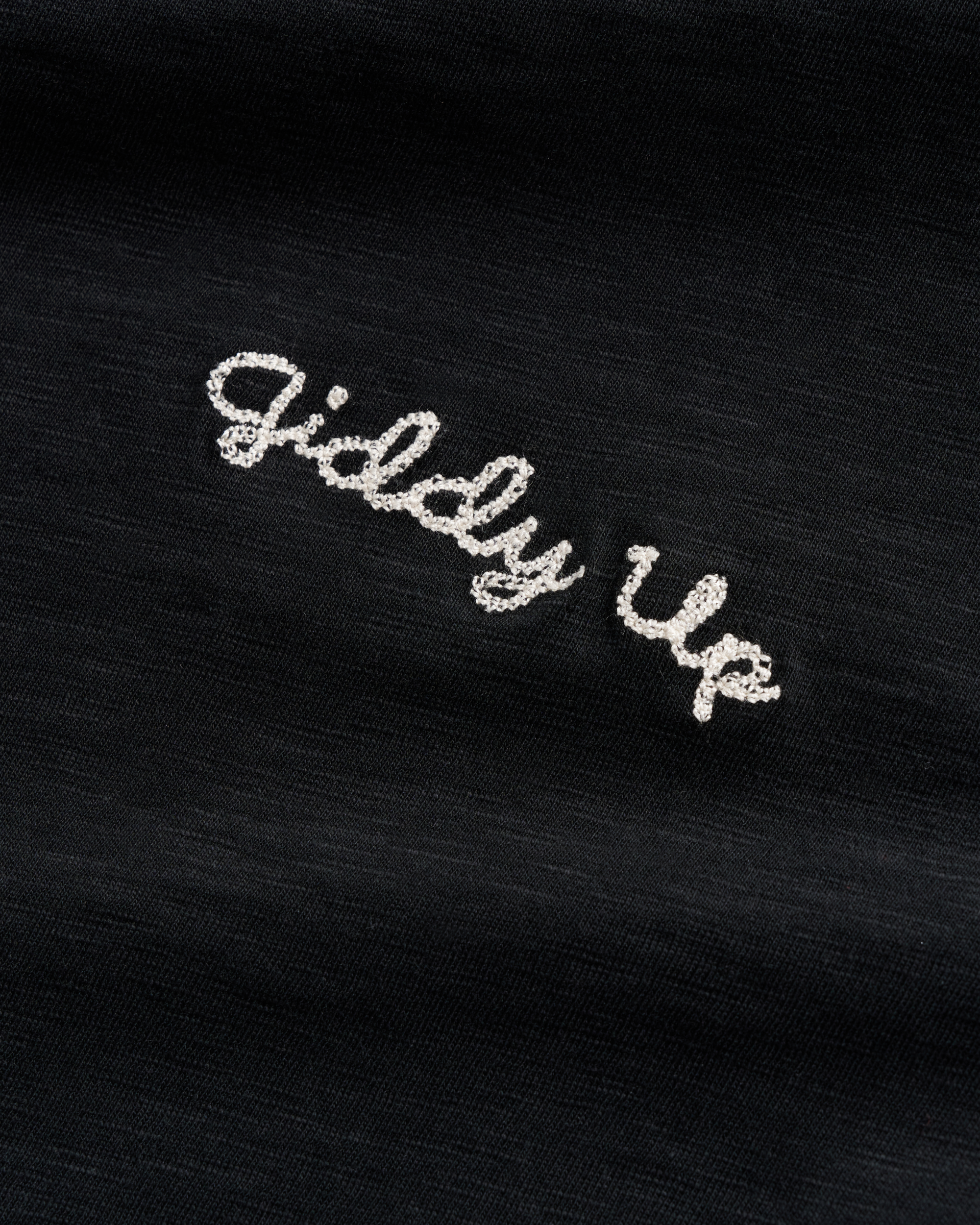 Closeup view of Women's Vintage Ringer Tee - Black / Bone