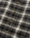 Closeup detail view of Women's Plaid Mini Skirt - Black / White