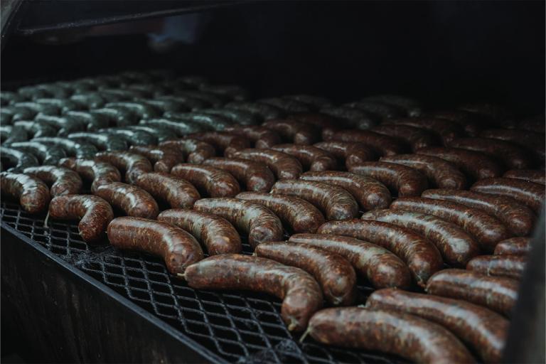 smoked sausages on a grill