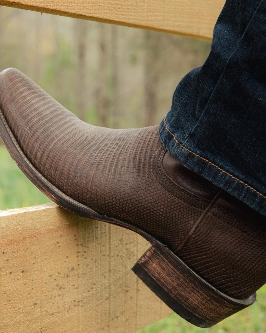 Man wearing the Chocolate Relic Lizard Lankford cowboy boots