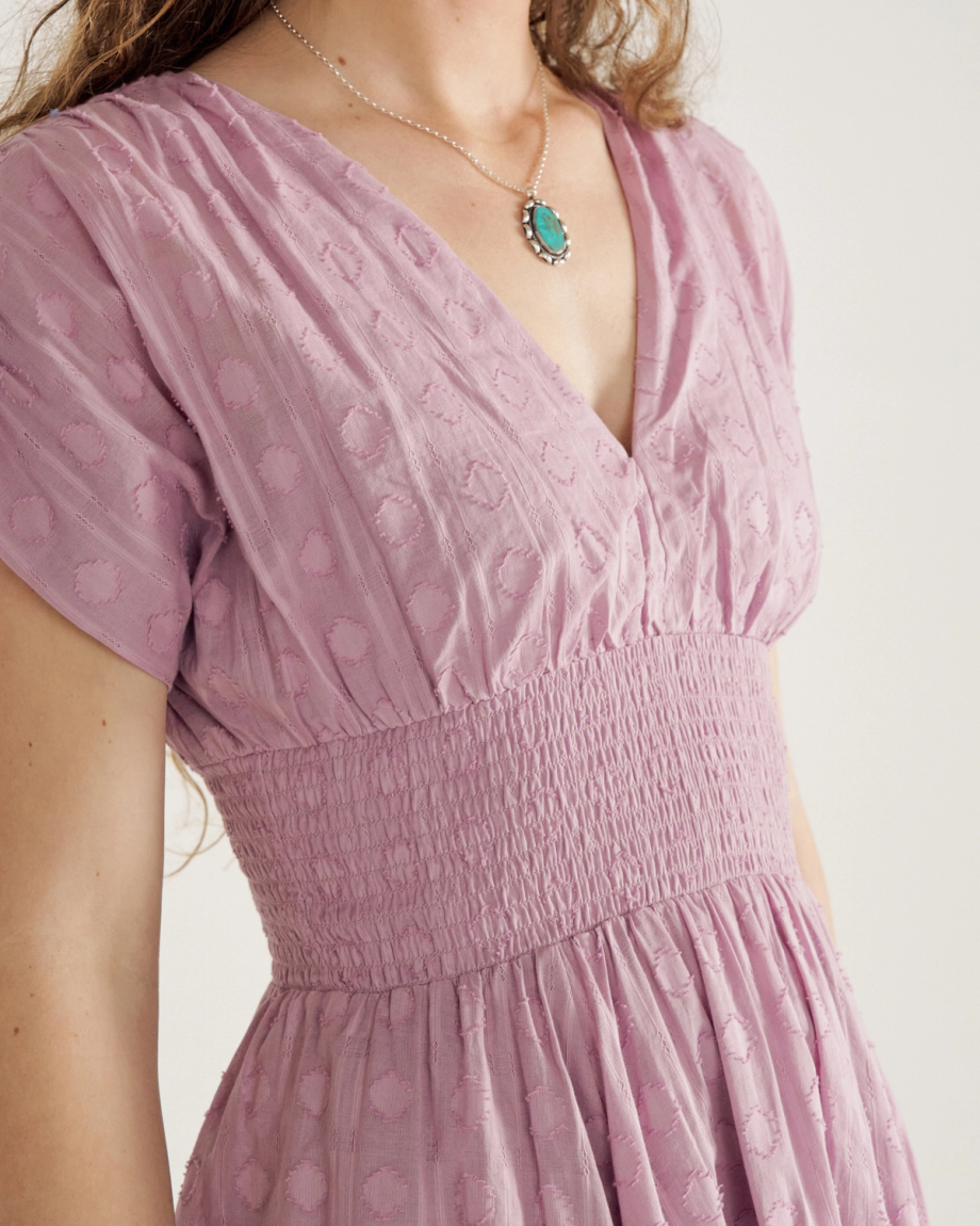 Front view of Women's Mini V-Neck Ruched Dobby Dress - Lavender on model