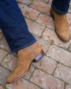 close up of Roy Honey Tan Suede cowboy boots on a man's feet 