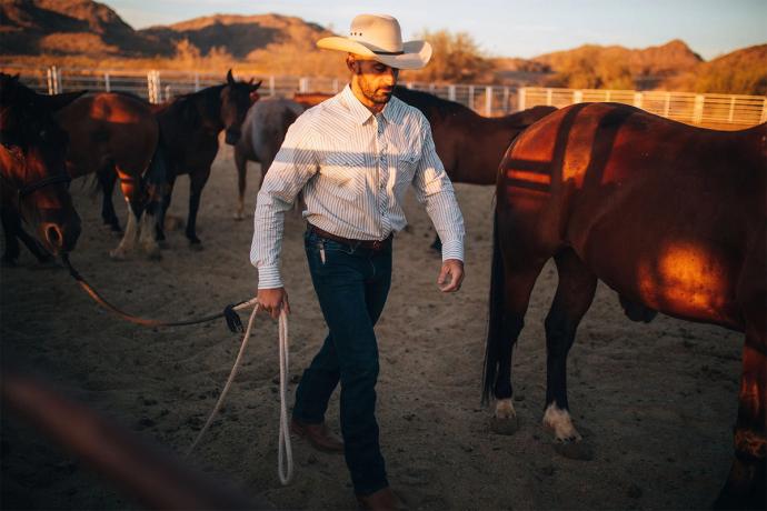 man leading a horse