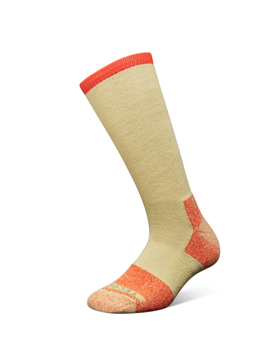 A single beige sock with orange-red accents on the toe, heel, and cuff, displayed against a black background.