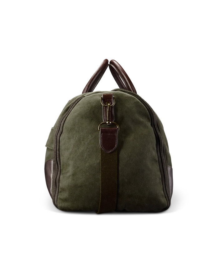 Green canvas duffel bag with brown leather accents and handles, standing upright against a black background.