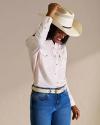 Person wearing the Tecovas Cattleman hat in the color natural straw. 