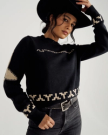 Front view of Women's Crew Neck Lucky Boots Sweater - Black on model