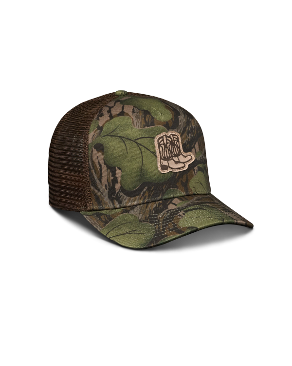 Quarterfront view of Tecovas x Mossy Oak Full Foliage Trucker - Full Foliage on plain background