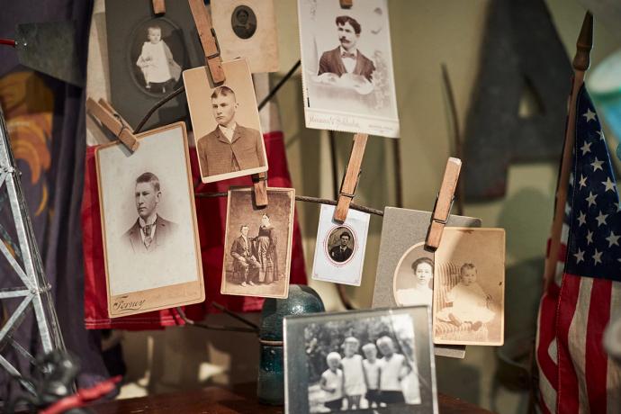 photographs on wooden pegs hanging on a string