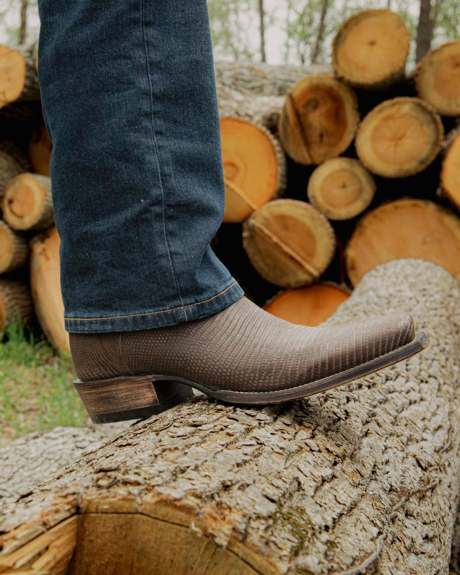Man wearing the Chocolate Relic Lizard Lankford cowboy boots