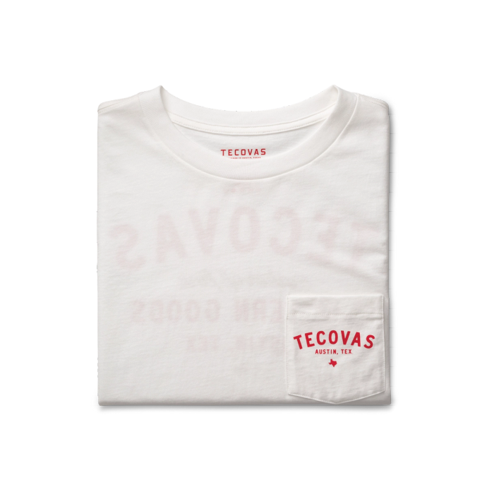 A folded white t-shirt with a red "TECOVAS AUSTIN, TEX" logo on the pocket.