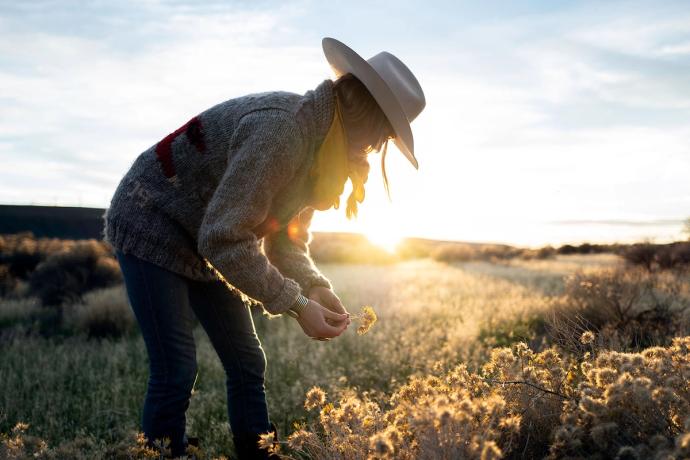 woman picking flowers