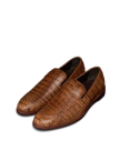 The Bennett in Saddle Alligator. A pair of brown alligator-patterned leather loafers with rounded toes and low heels, displayed on a white background.