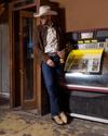 Cowboy in an old bar wearing The Barton in black sand python
