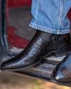 close up picture of Cole Midnight Black cowboy boots on a man's feet