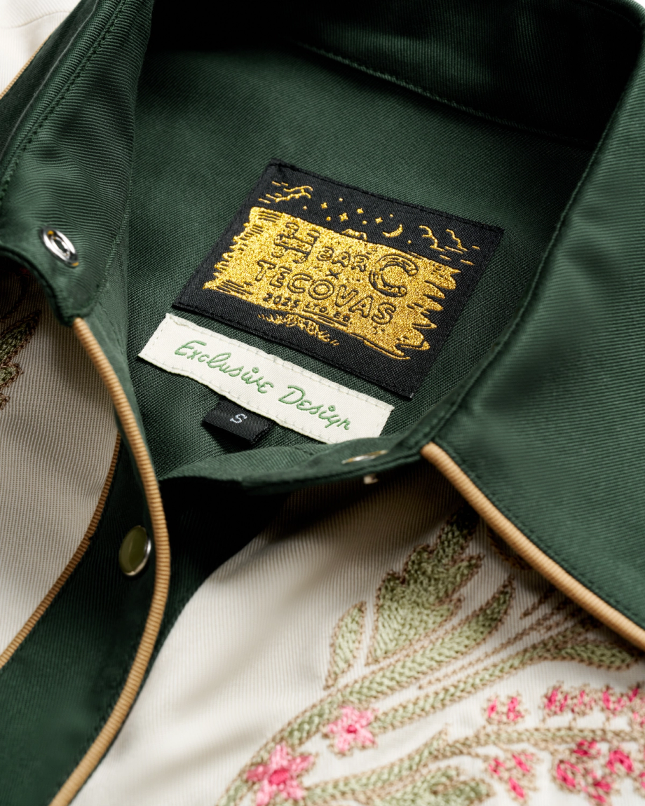 Closeup detail view of Women's Tecovas X H Bar C Birthday X Shirt - Green