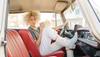 woman in a car in cowgirl boots