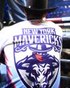 Person wearing a cowboy hat and a "New York Mavericks" jersey with a bold graphic of a cowboy and bull on the back.