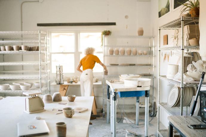 woman working in pottery studio