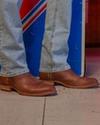 Man wearing a pair of the Tecovas Dean that are "fowler heels."