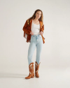 Full view of The Annie - Pecan / Bone Cowhide on model