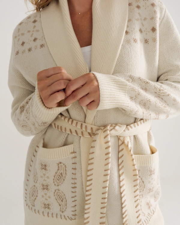 Closeup detail view of Women's Shawl Collar Wrap Sweater - Cream / Tan