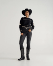 Full view of Women's Crew Neck Lucky Boots Sweater - Black on model