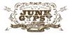 Vintage-style logo for Junk Gypsy in Round Top, Texas, featuring an old truck loaded with cargo, ornate decorative elements, and text highlighting "Purveyors of the World's Finest Junk.