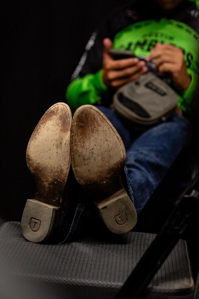 Tecovas boots propped up