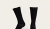 Image of black, mid calf boot socks