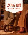A pair of brown cowboy boots on a red sofa with text above stating "20% Off EVERYTHING.