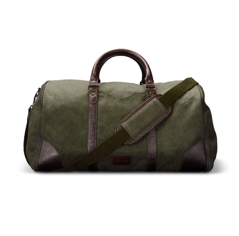 A large green duffel bag with brown leather accents and a shoulder strap.