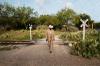 man walking by railroad tracks