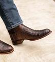 close up picture of Cole Mahogany brown cowboy boots on a man's feet