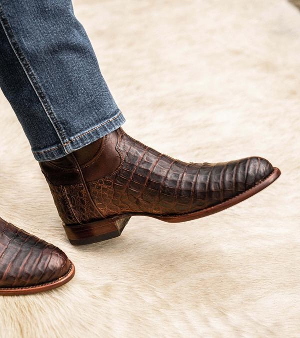 close up picture of Earl Mahogany brown cowboy boots on a man's feet