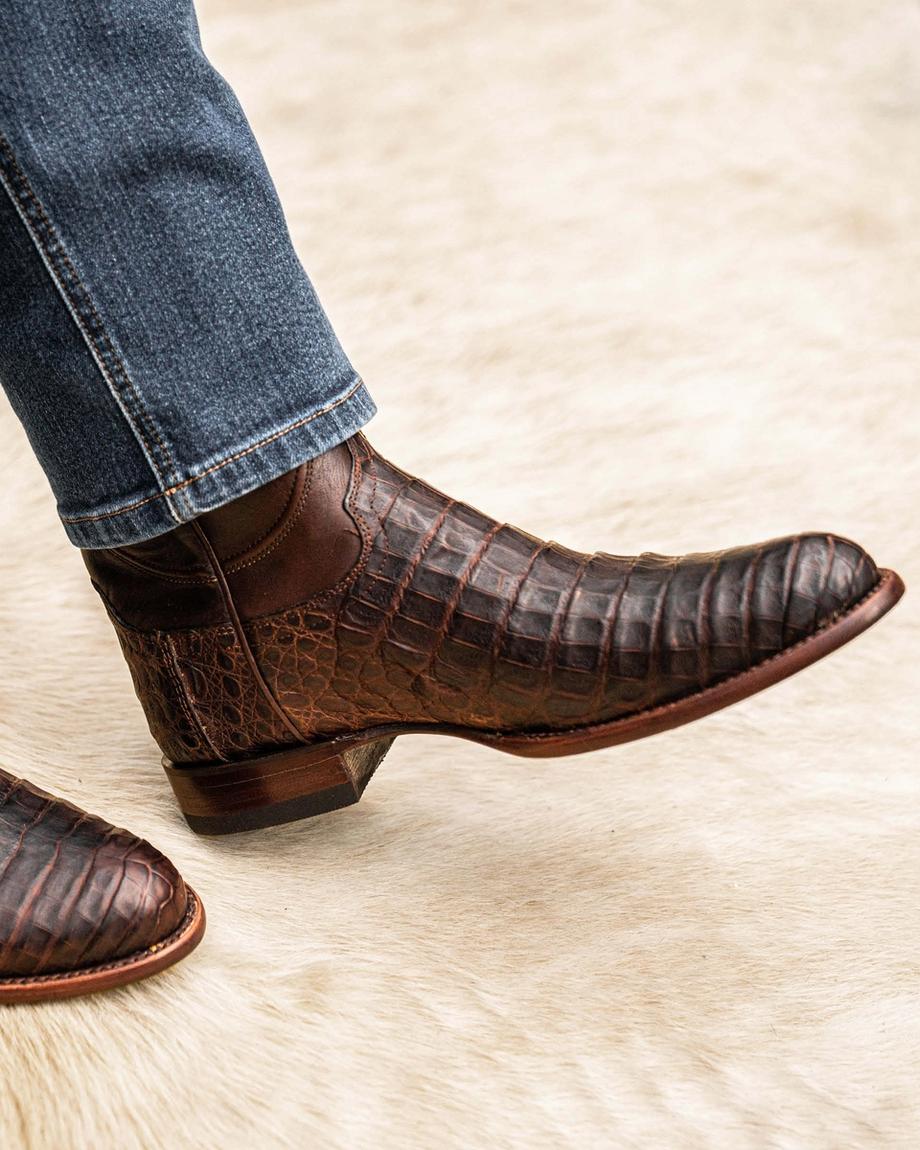 close up picture of Cole Mahogany brown cowboy boots on a man's feet