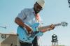 Abraham Alexander playing an electric guitar