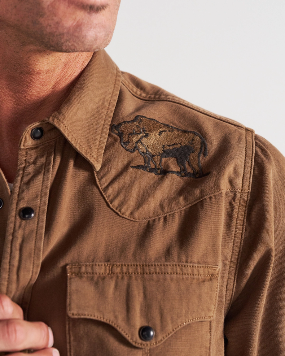 Closeup detail view of Men's Denim Pearl Snap - Tobacco
