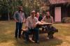 four men at a picnic table