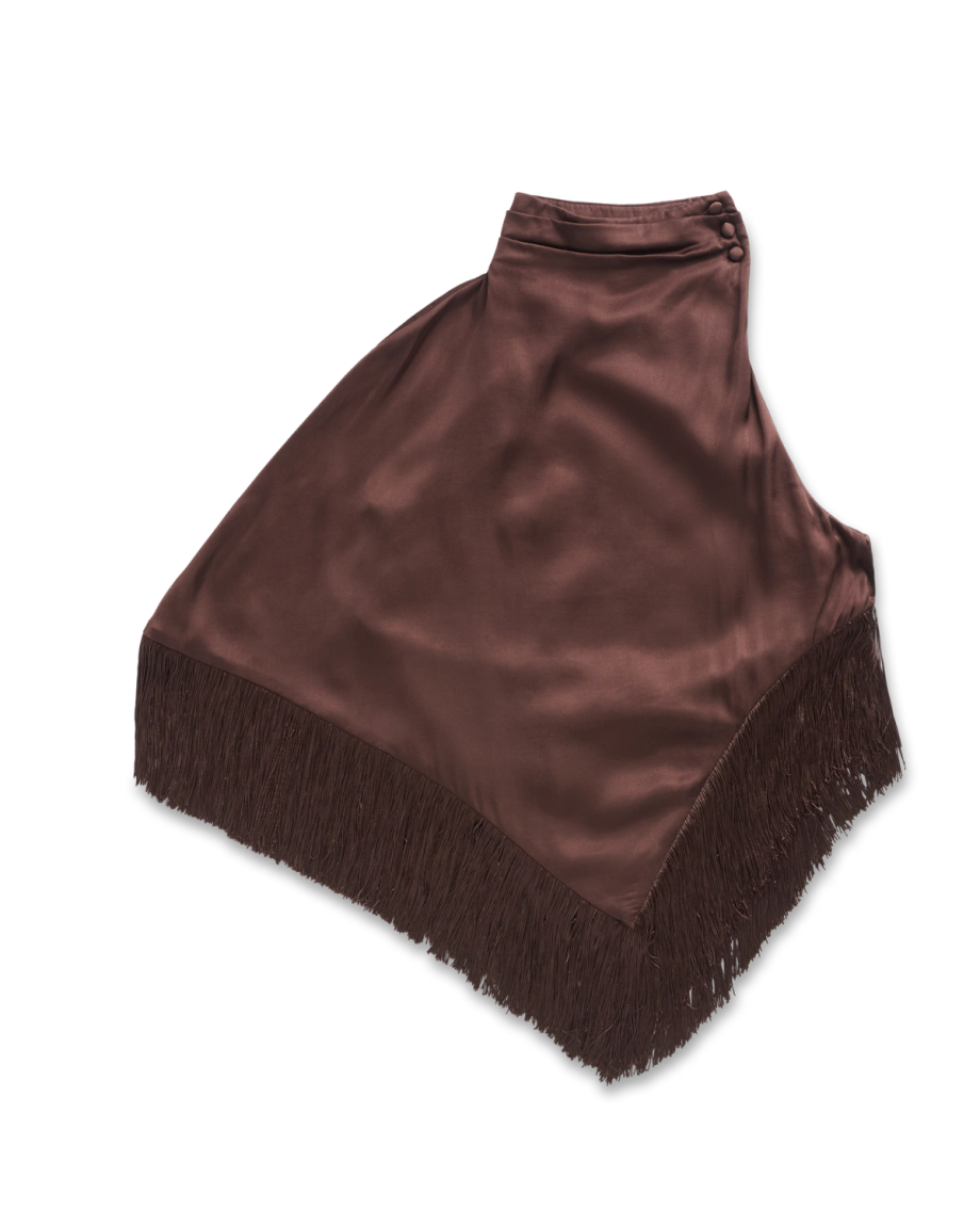 Brown satin asymmetrical wrap skirt with fringe trim along the bottom edge, featuring button closure at the waist, displayed on a white background.