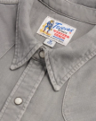 Closeup detail view of Men's Denim Pearl Snap - Light Gray
