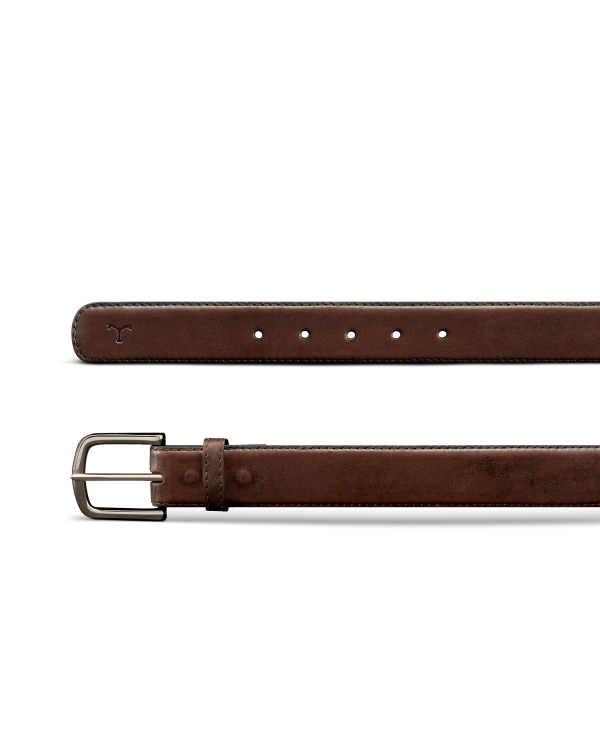 A brown leather belt with a silver buckle, featuring five holes and a small bull logo embossed near the tip.