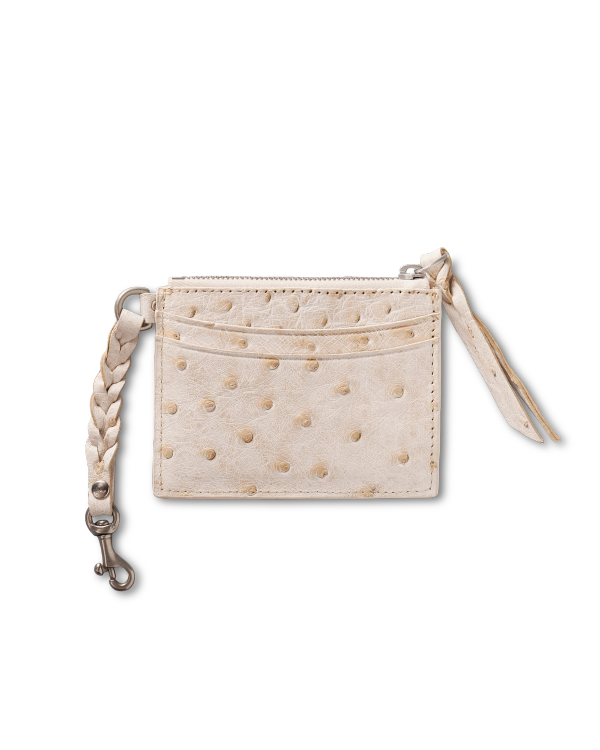 A small, cream-colored leather card holder with a zippered compartment, front pocket, and a braided wrist strap with a metal clasp.