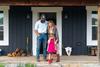 family standing on front steps