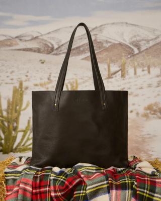 Holiday lifestyle of leather tote in midnight