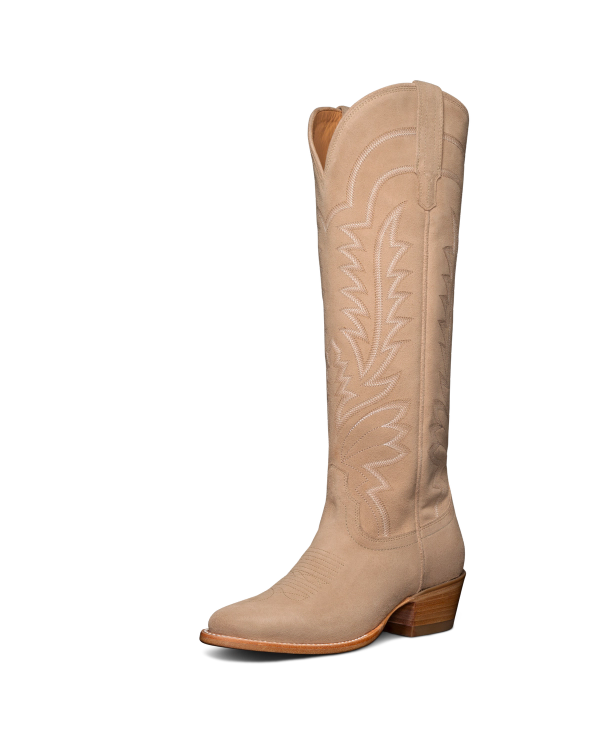 Tan cowboy boot with decorative stitching and a wooden heel, positioned against a black background.